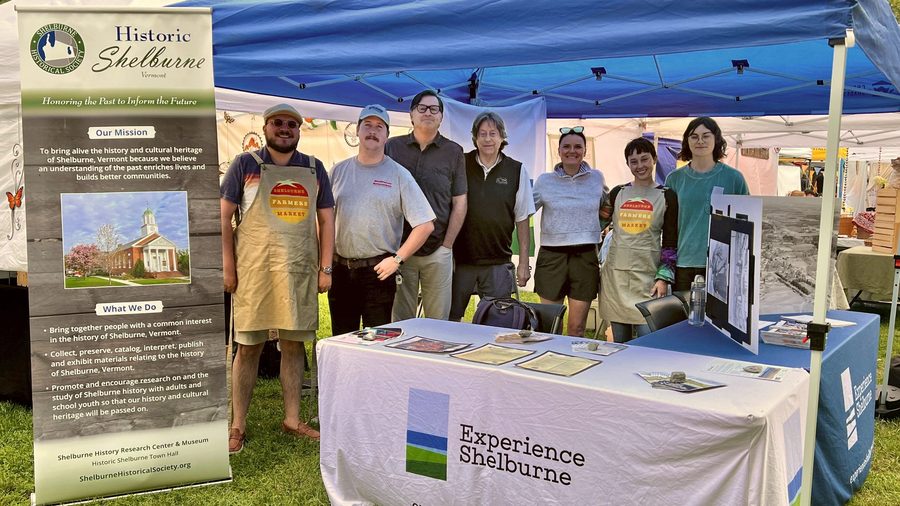A Saturday at the Shelburne Farmers Market on the Parade Grounds — tents, produce, and a crowd