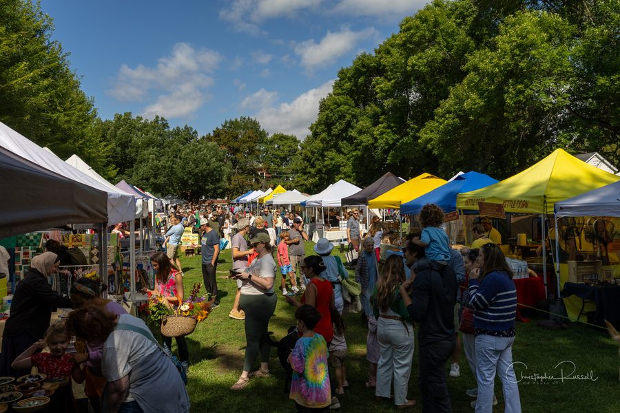 Saturday crowds among the vendor tents on the Parade Grounds